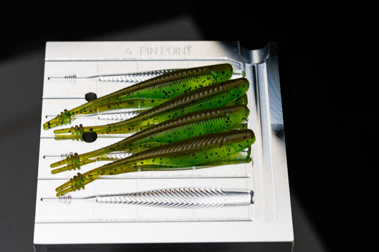 Angling A.i. 4 inch Pin Point aluminum mold with poured soft plastic swimbait trailers